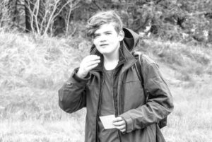 Nick, who participated in a clinical trial for autism, walks in the woods