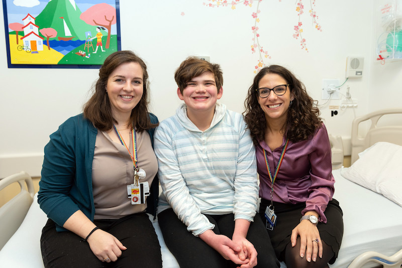 Nick, who has autism, with Kate Pawlowski and Dr. Nicole Baumer 