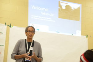 Dr. Shari Nethersole speaks at a community meeting.