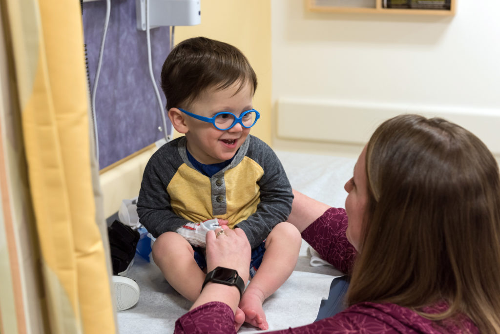 boy with stroke visits with occupational therapist