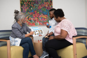 Margie Lorenzi meets with a family at Boston Children’s.