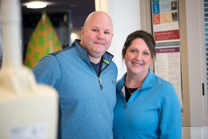 Lisa and Michael Greenlee, two nurses in the Cardiac ICU, pose in the hospital