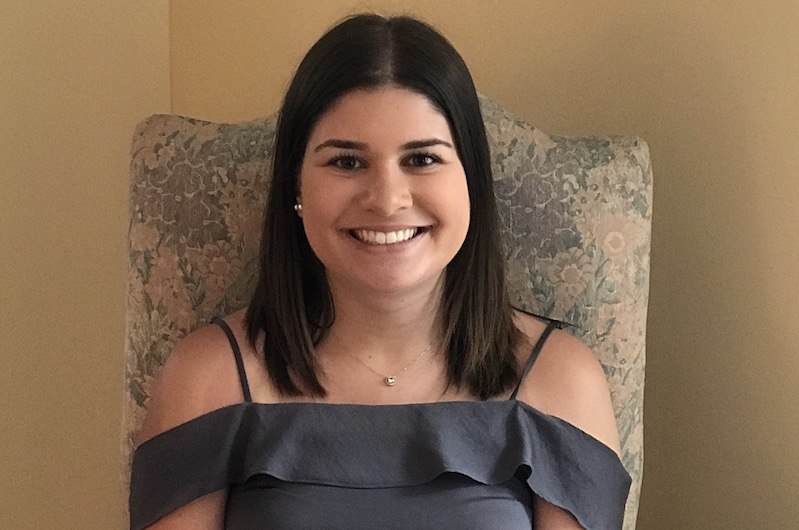 Olivia, who was inspired to become a nurse, smiles at the camera.