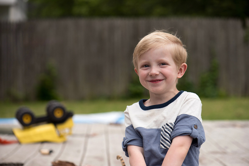 Jack, who was treated with chemotherapy to fight his PVS, plays outside on his deck.