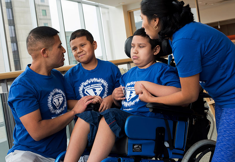 The Rojas family, who have two sons with ALD,at a recent visit to Boston Children’s.