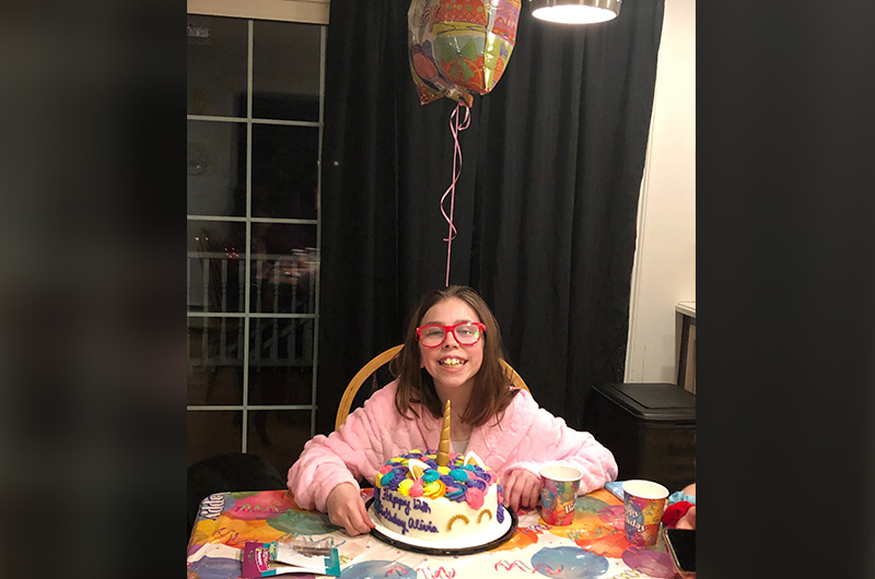 girl with cdh celebrates her birthday with a cake