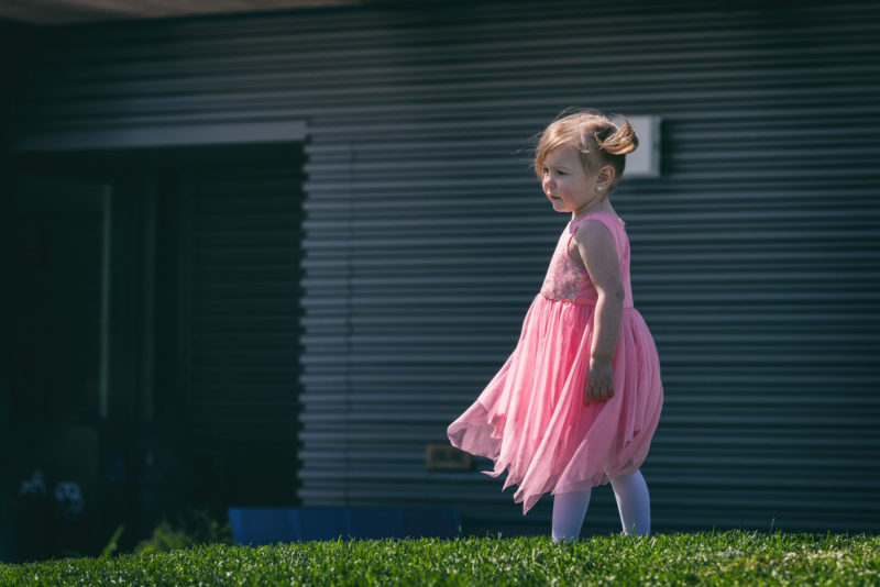 little girl with cdh wears a pink dress
