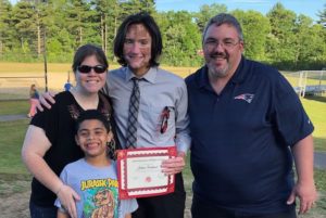 Josh, who has von Hippel-Lindau syndrome, poses with his family