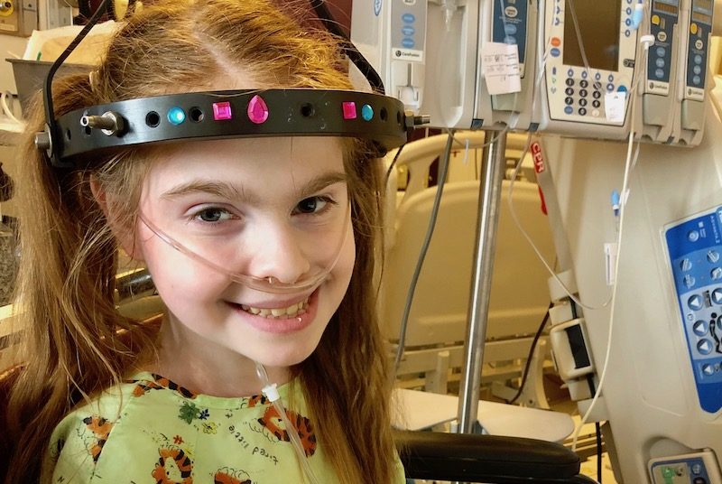 Lexi, who had complex spine surgery, works while in the hospital