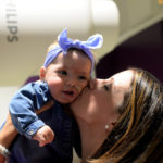 mom holds her aspirating baby