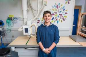 Andrew, who had limb salvage surgery, poses at a recent check up.
