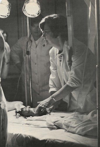 Dr. Avery examines an infant