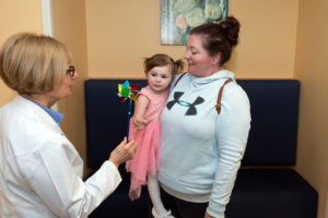 nurse donna morash meets with a patient and her mom