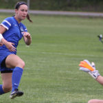 Emily, who had ACL reconstruction surgery, playing soccer.