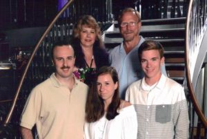 Felicia, who was diagnosed with familial paraganglioma-pheochromocytoma syndrome, poses with her family