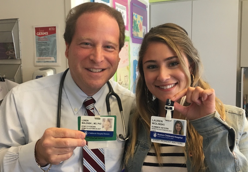 Dr. Loren Walensky and an intern holding name badges that show they have the same name.