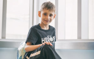 mason sits in the hospital before a visit for his dyskeratosis congenita