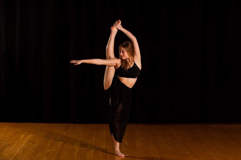 Nicole, who had PAO surgery for hip dysplasia, performs an acrobatic move during a dance performance.