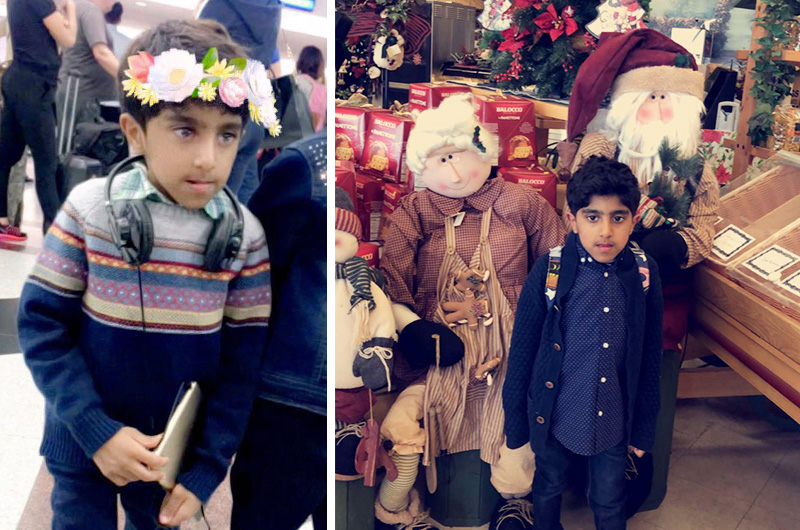Saif, who was born with a deformity of the cervical spine, wearing headphones and standing next to life-sized Christmas dolls.