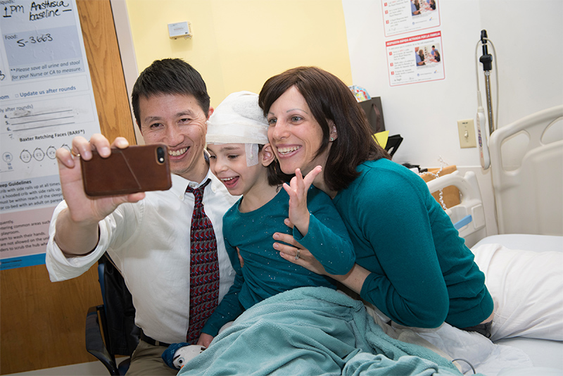 Dr Timothy Yu with Batten disease patient and her mom