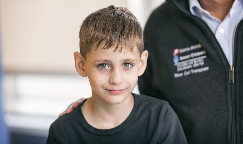 boy with dyskeratosis looking directly at camera