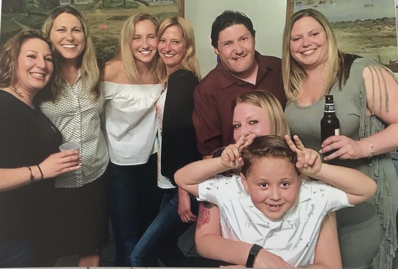 Joey, who has DiGeorge syndrome, poses with his family.