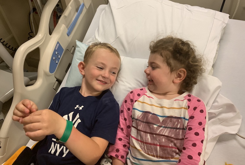 Robbie and Ellery share a laugh in the hospital