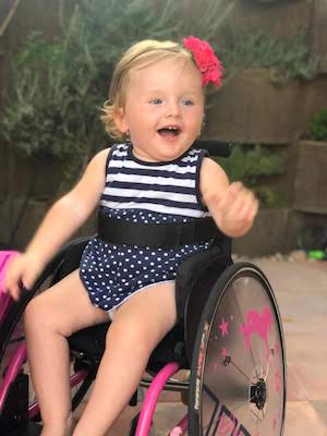 Sofie, who has spinal muscular atrophy, in her wheelchair