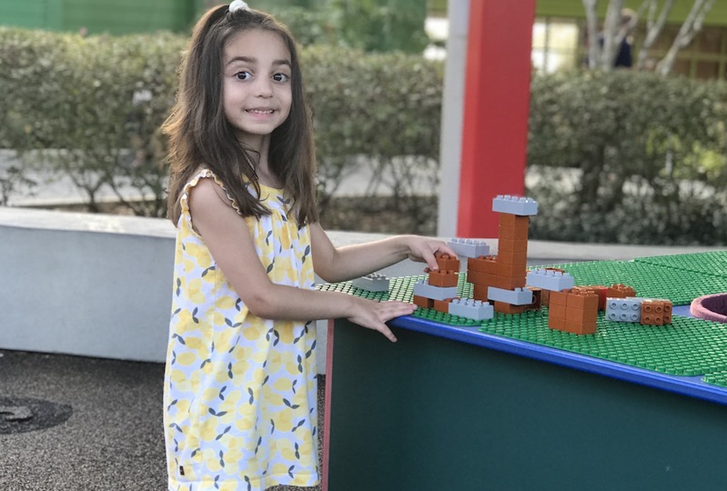 Mary, who has Dravet syndrome, plays with Legos