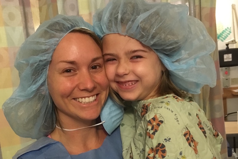 Zeeva, who has a rare type of epilepsy, poses in hospital scrubs with her mom