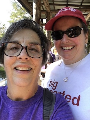 An adult heart patient with her doctor at a charity walk