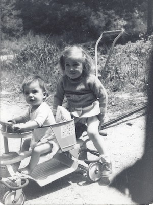 Fran, now an adult heart patient, as a child on a bike with her older sister