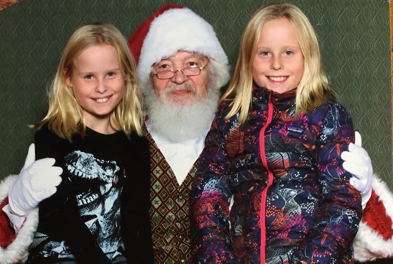Twins who have spent holidays in the hospital sit with Santa