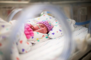 Premature baby sleeps in NICU