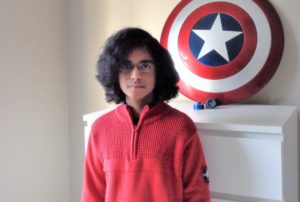 Ali, who had ALL, poses in his bedroom