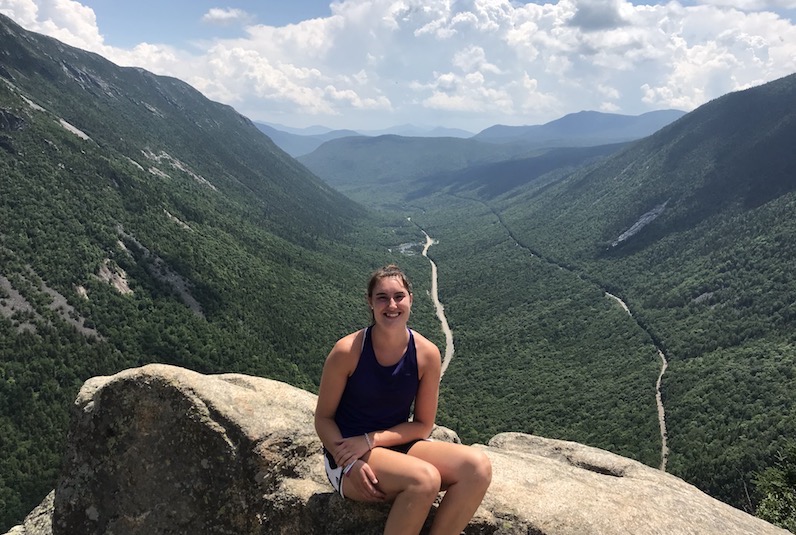 Kristen, who had surgery for epilepsy, poses in front of mountains
