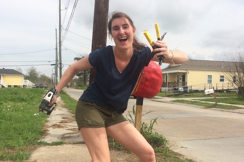 Kristen, who had epilepsy surgery, poses with tools near her house