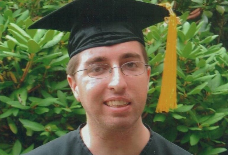 Jason, who had surgery for epilepsy, at his high school graduation