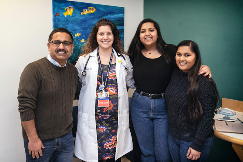 maya poses with her family and thyroid doctor
