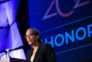 Shari Nethersole speaks at a podium about community health