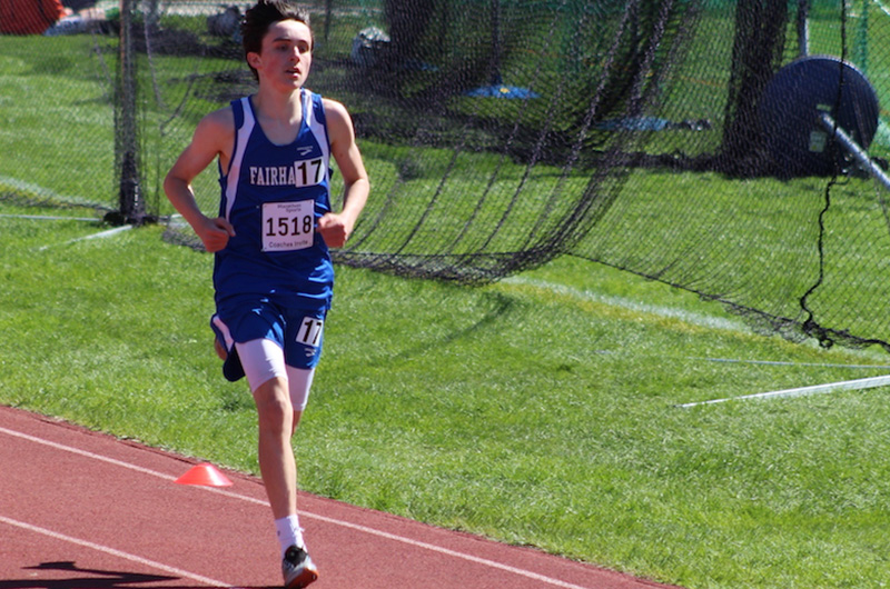 Will, who had an avulsion fracture, runs in a race wearing his blue school jersey. 