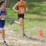 Will, who had an avulsion fracture, runs with the pack in an outdoor cross country meet.