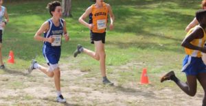 Will, who had an avulsion fracture, runs with the pack in an outdoor cross country meet.