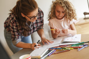 mom and daughter coloring during covid-19 shutdown