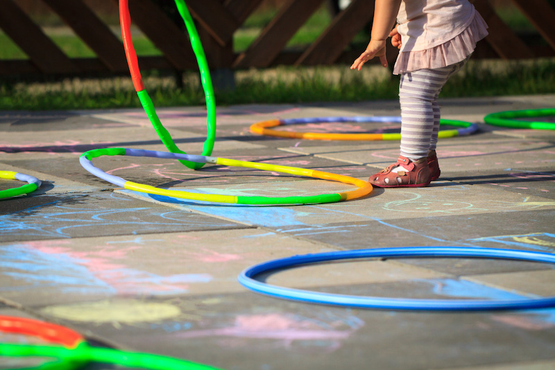 children playing with hula hoops to denote vascular rings