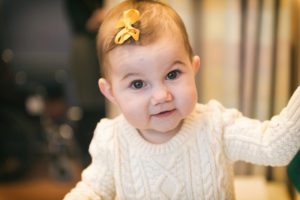 hannah, a baby with short bowel syndrome, looks at the camera