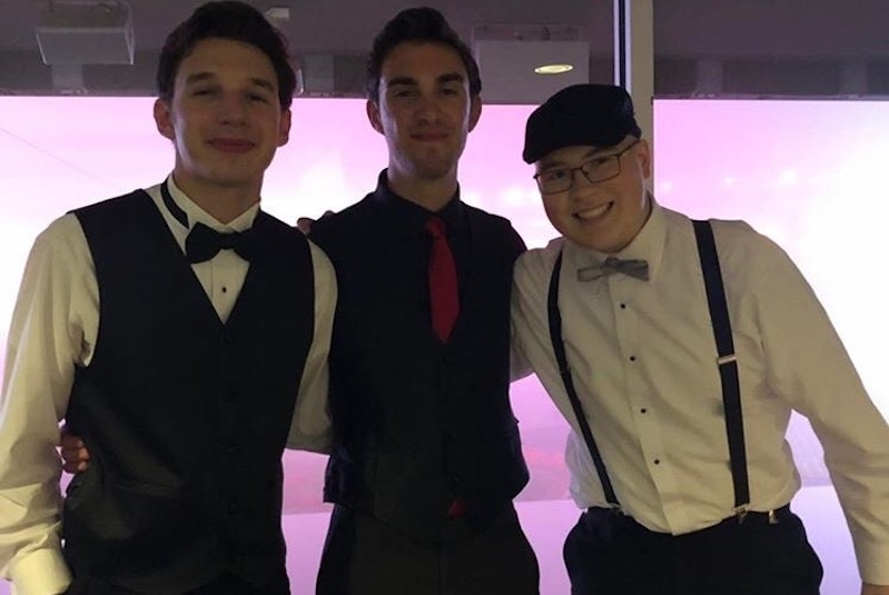 Ben, who has ALL, posing with his two friends at prom in 2019