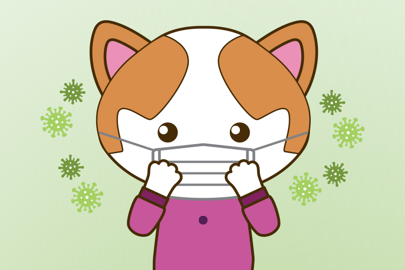 Cartoon of cat wearing a mask with cartoon viruses around it