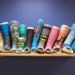 A row of decorated casts on the shelf of the Orthopedic Urgent Clinic.