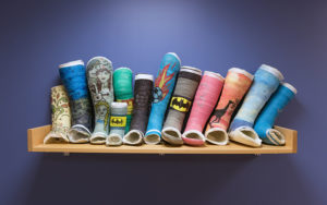 A row of decorated casts on the shelf of the Orthopedic Urgent Clinic.